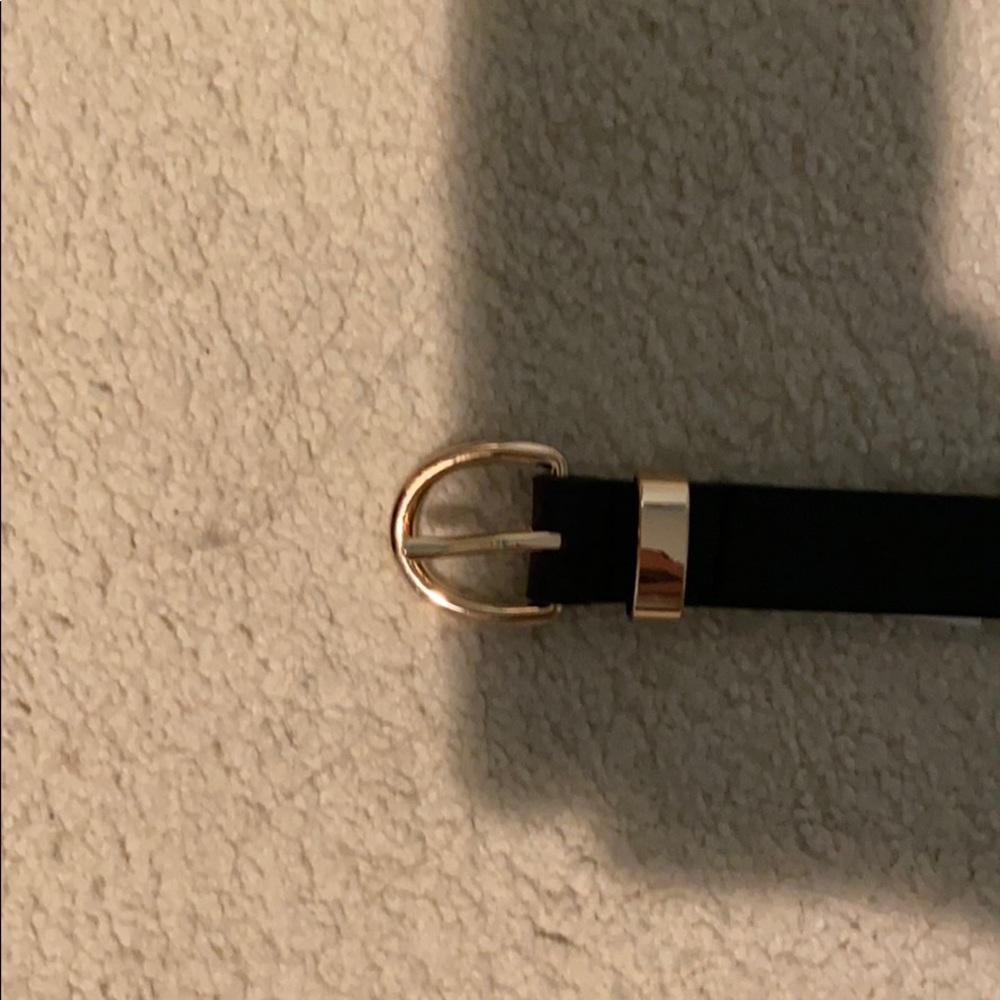 Black belt with gold buckle